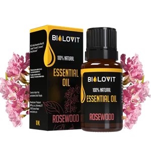 Pudełko i buteleczka z różowymi kwiatami w tle