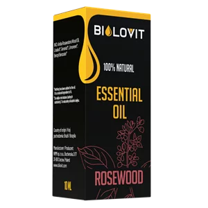 Pudełko i buteleczka z różowymi kwiatami w tle